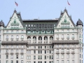 A fantastic mansard roof crowns Plaza Hotel, underscored by tiers of balustrades and terra cotta.